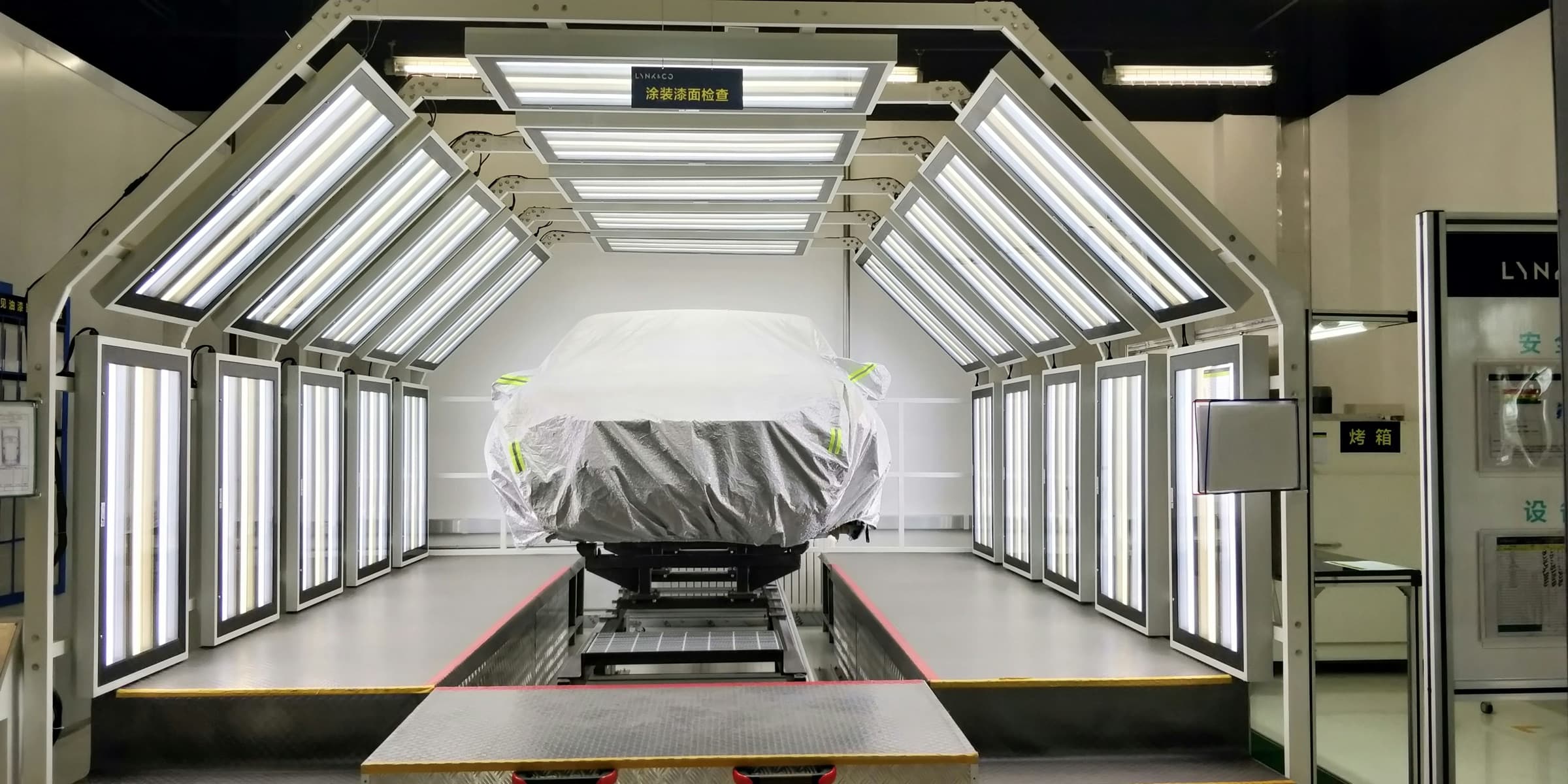 Vehicle in an engineering inspection chamber representing commercial acoustic modelling workflows